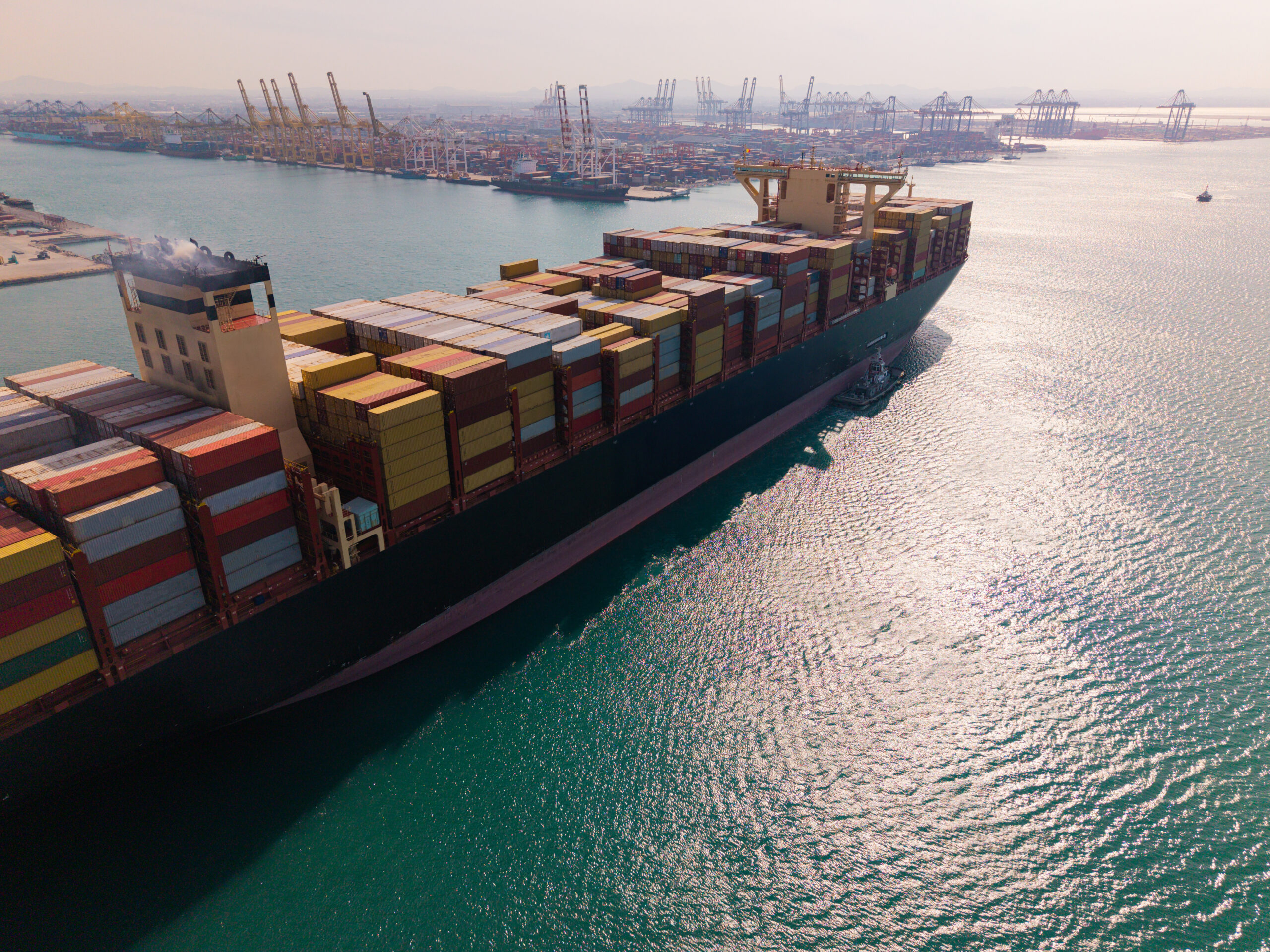 Large cargo ship transporting colorful containers across ocean